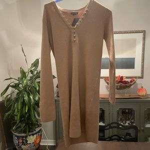 Camel sweater dress with matching covered buttons. Never worn original tags